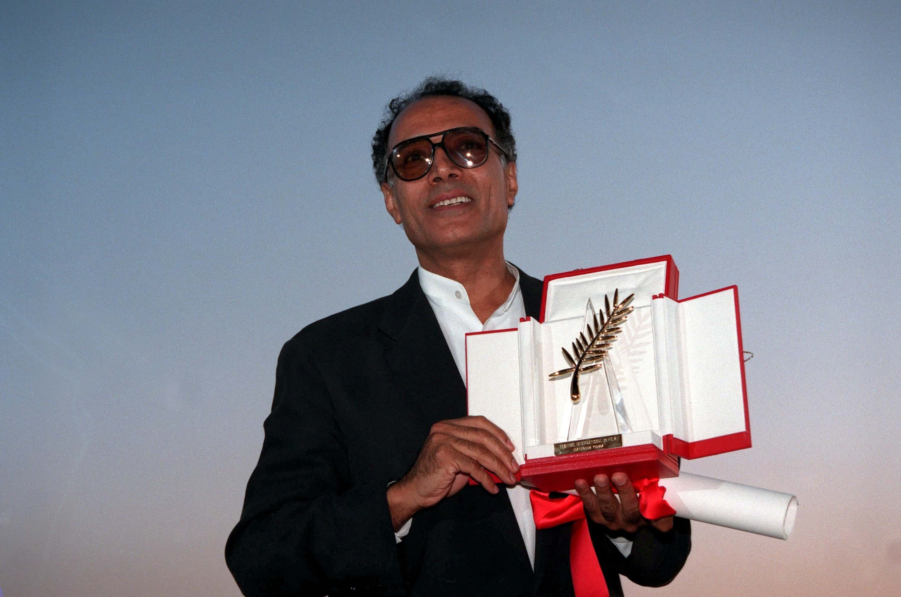 Abbas Kiarostami receiving the Palme d'Or at the Cannes Film Festival, 1997