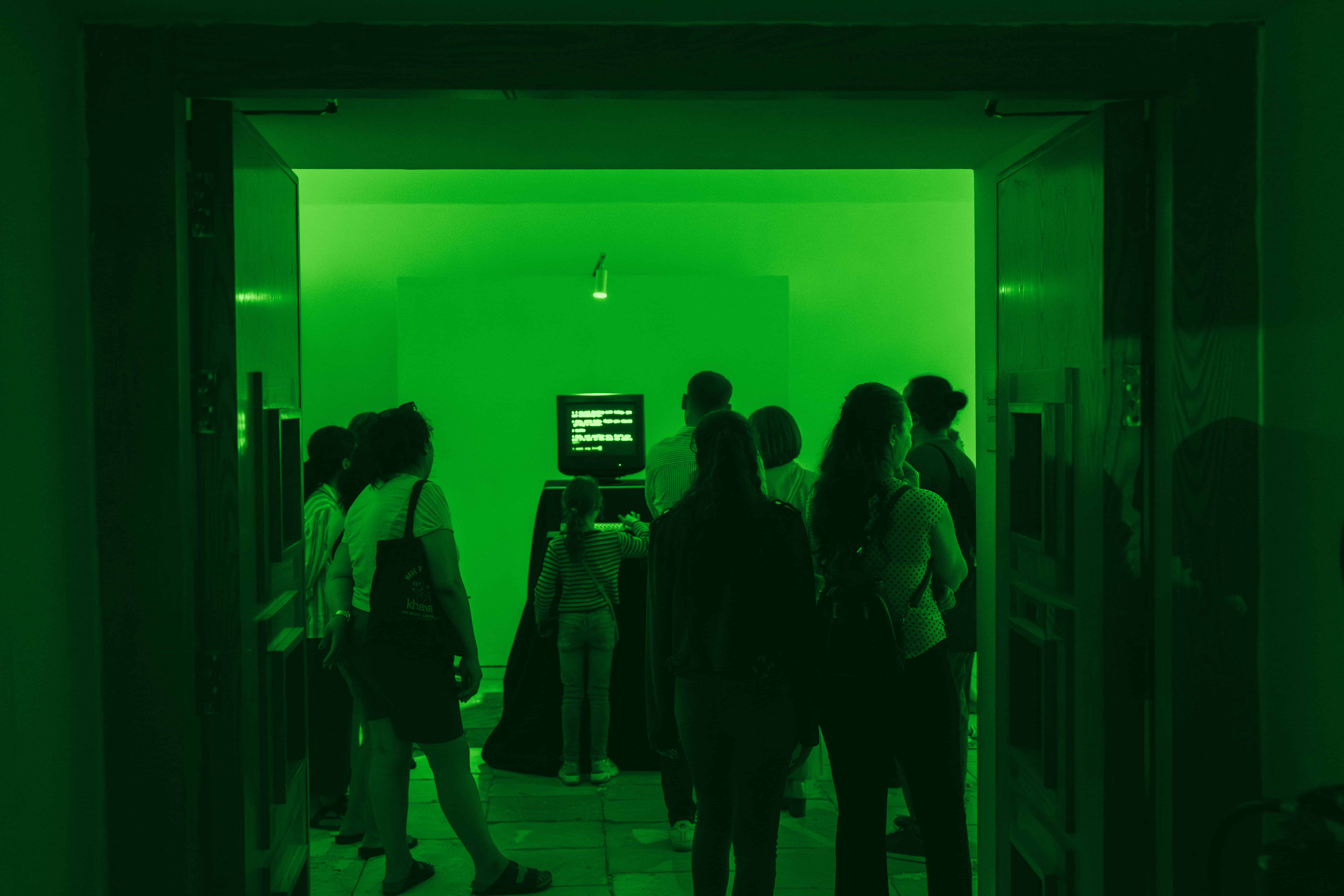 Exhibit opening, with crowd around James Borg's debut artwork.