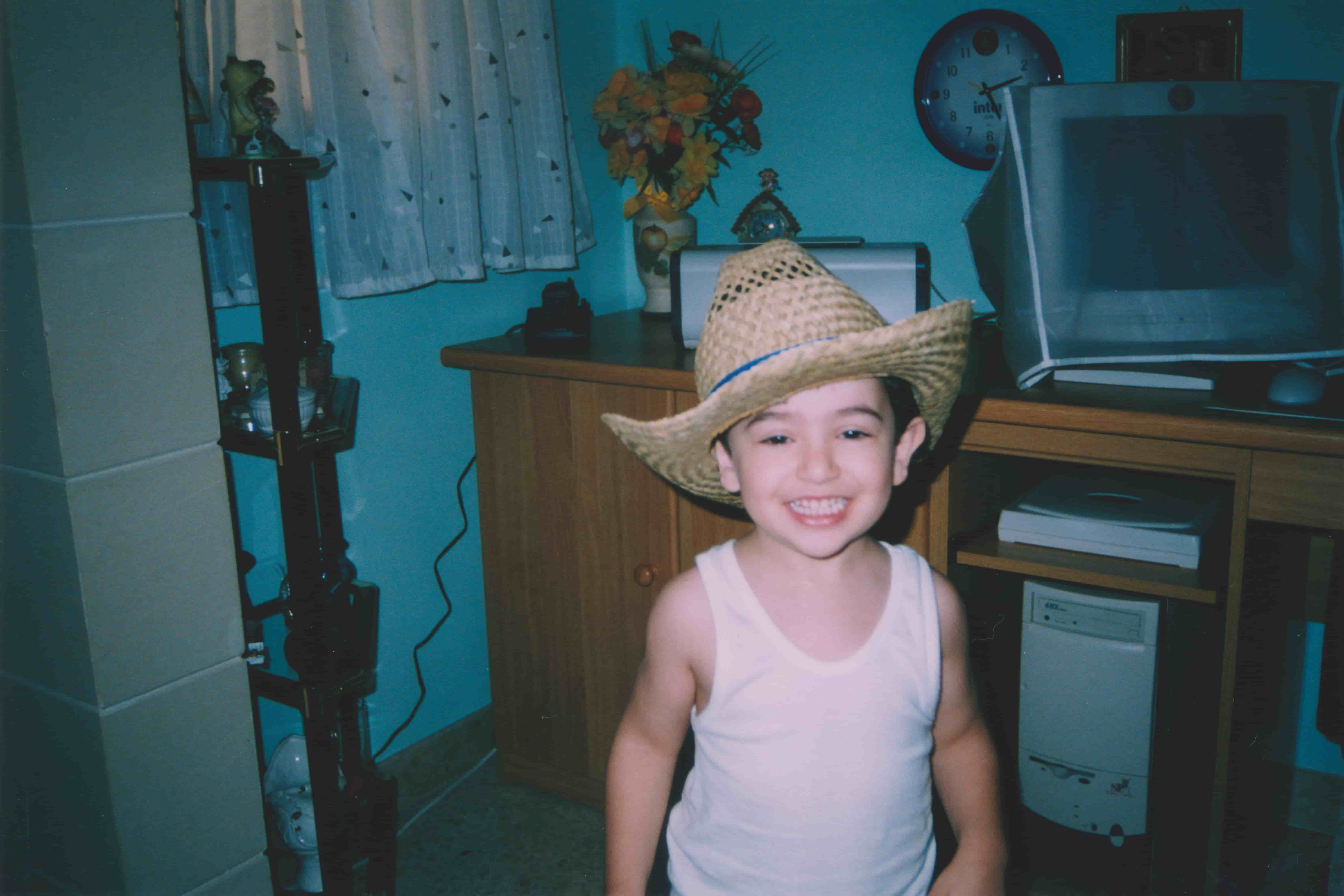 Young James in front of his home computer